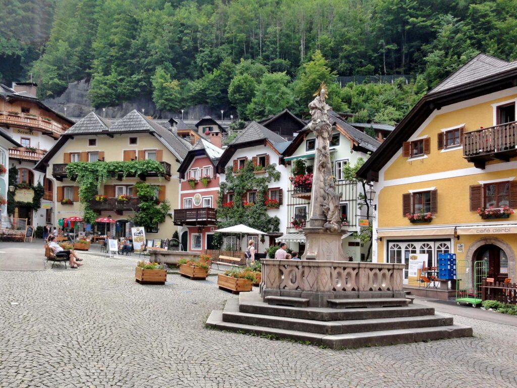 Market square with colorful alpine houses in Hallstatt, Austria