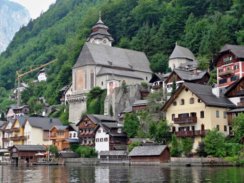 Historic church above lakeside houses in Hallstatt, Austria