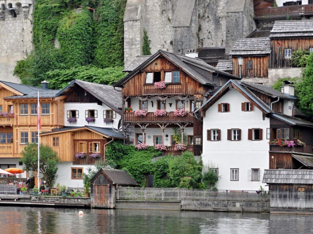 Wooden lakeside houses with flower balconies in Hallstatt, Austria