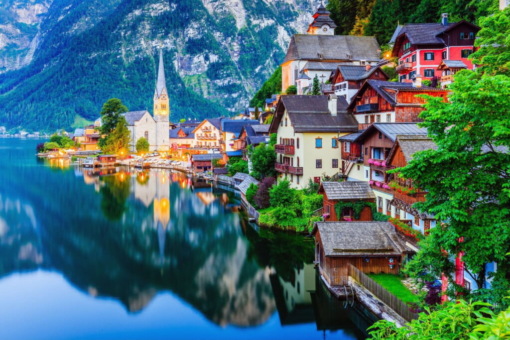 Hallstatt lakeside village and church reflected on Lake Hallstatt, Austria