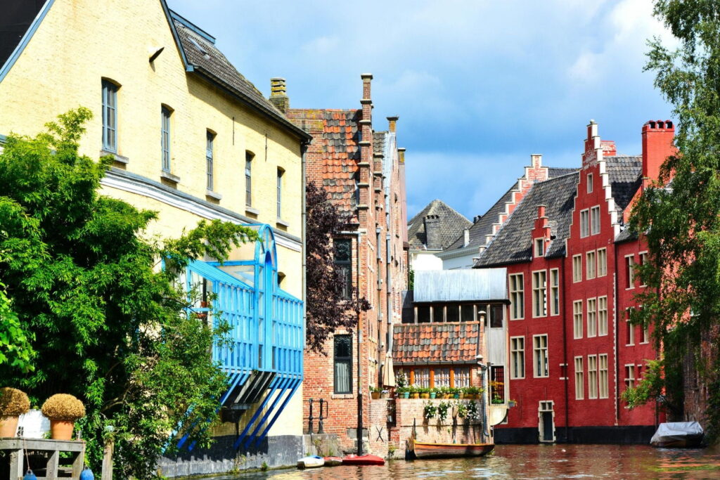 Traditional canal houses along a quiet waterway in Ghent, Belgium