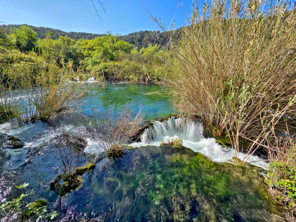 Small waterfall and turquoise pool in Krka National Park, Croatia