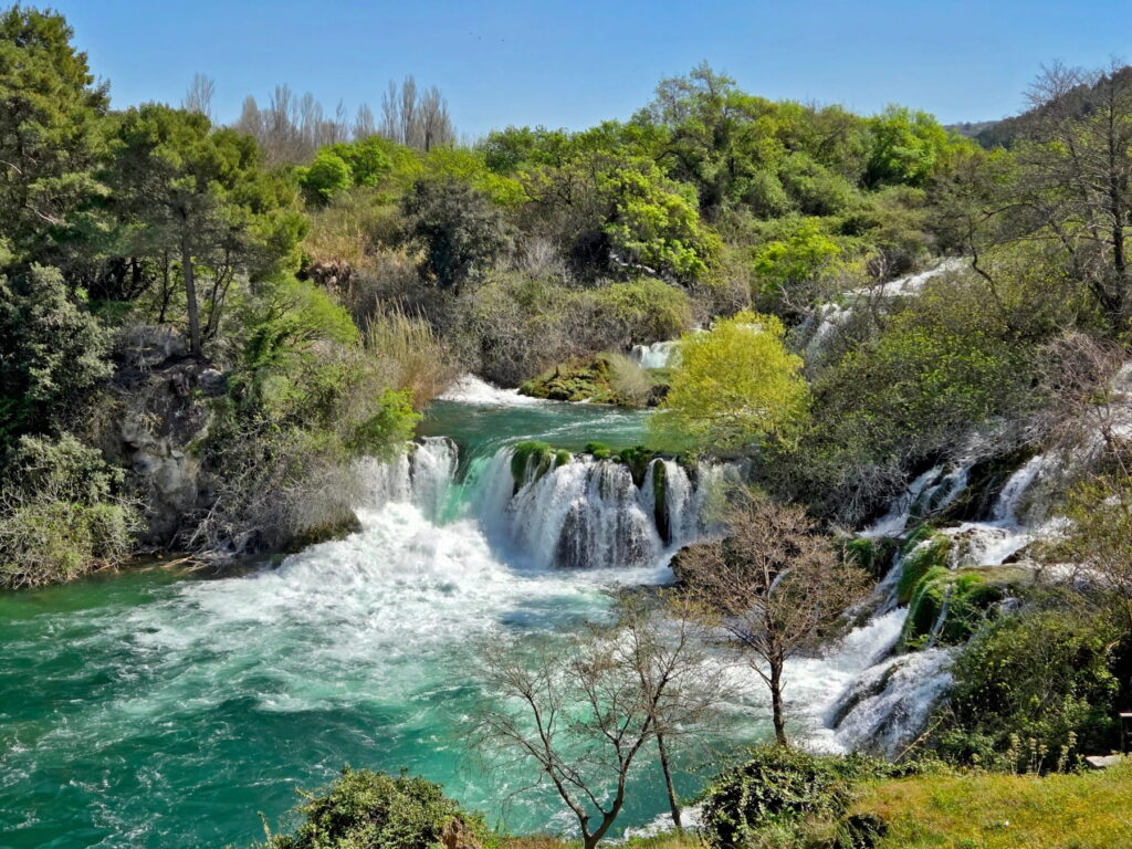 Turquoise waterfalls surrounded by forest in Krka National Park, Croatia