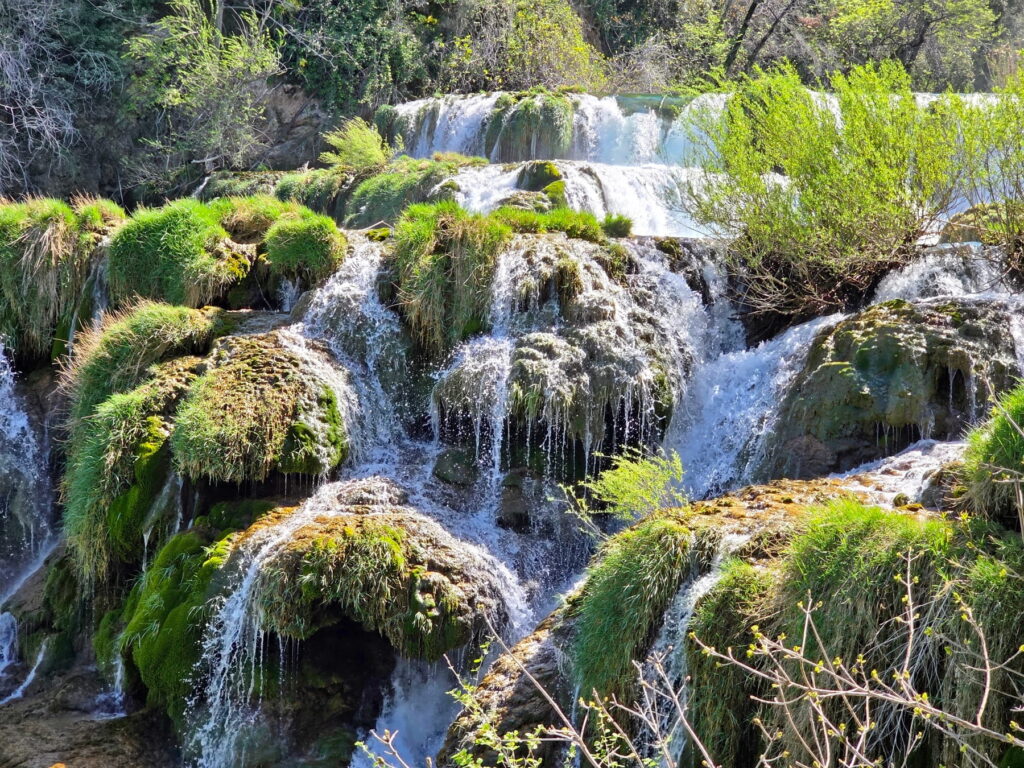 Close-up of cascading waterfalls and green moss in Krka National Park, Croatia