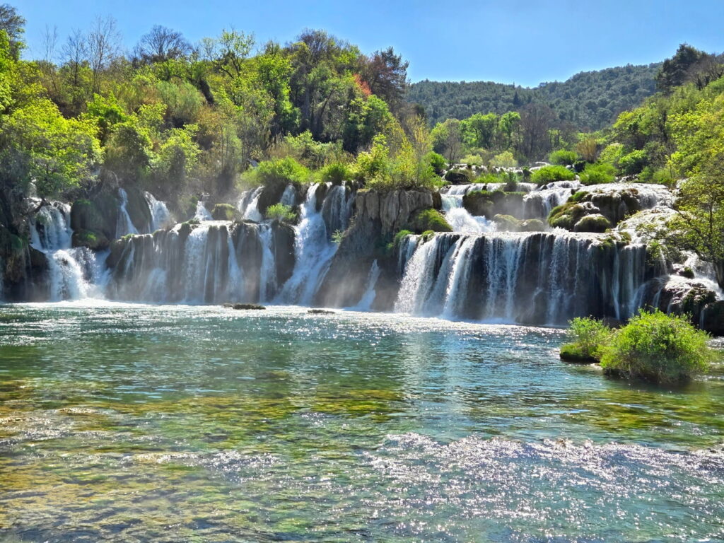 Large waterfall lake and forest scenery in Krka National Park, Croatia