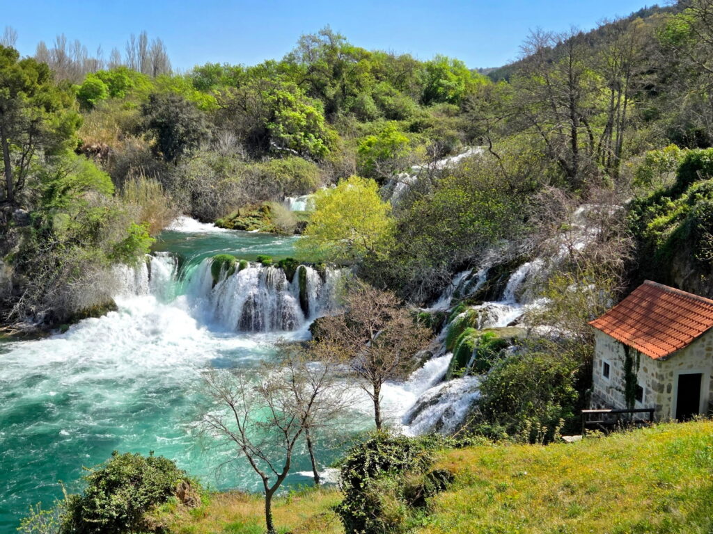 Waterfalls and stone house in Krka National Park, Croatia