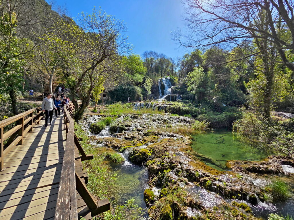 Wooden trail leading toward waterfalls in Krka National Park, Croatia