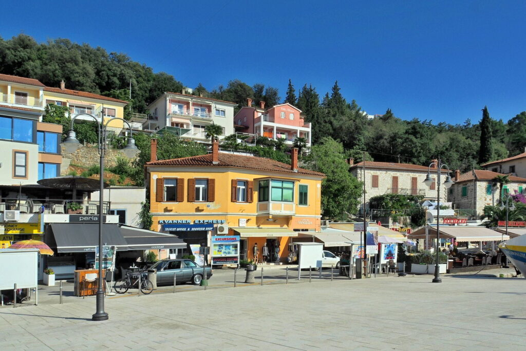Colorful seaside buildings and promenade in Rabac, Croatia