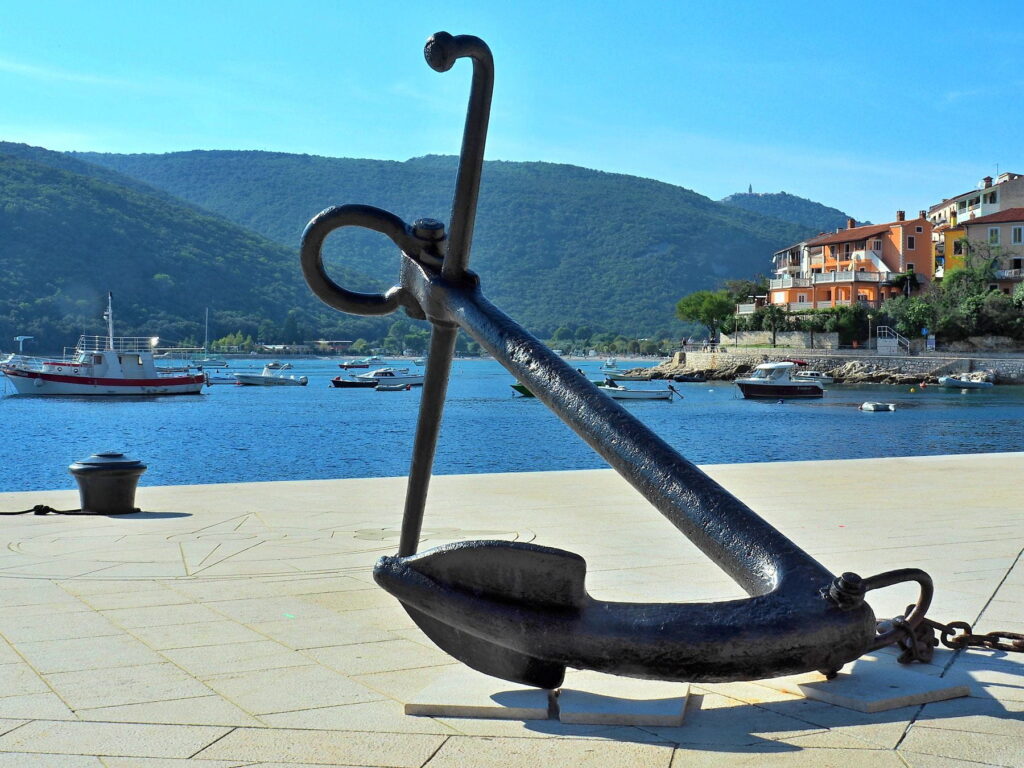 Large anchor sculpture beside the waterfront in Rabac, Croatia