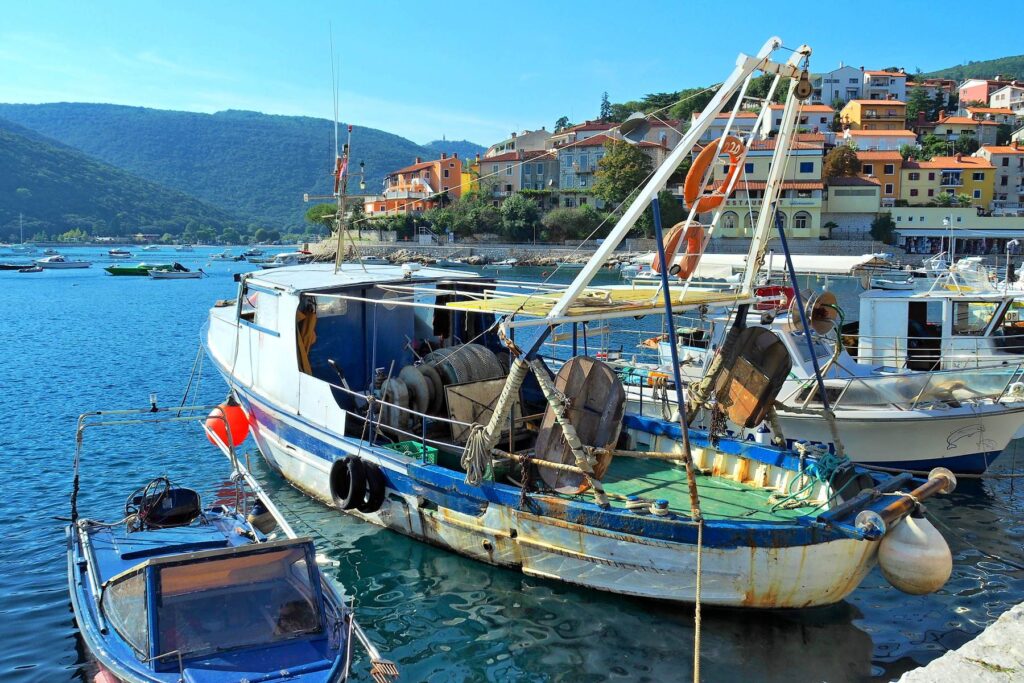 Traditional fishing boats moored in Rabac harbor, Croatia