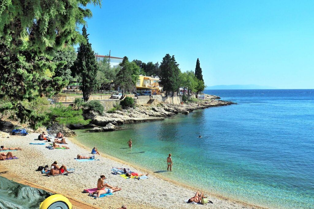 Pebble beach and clear Adriatic water in Rabac, Croatia