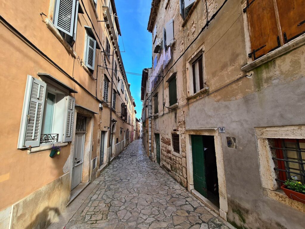 Cobblestone street lined with historic houses in Rovinj, Croatia