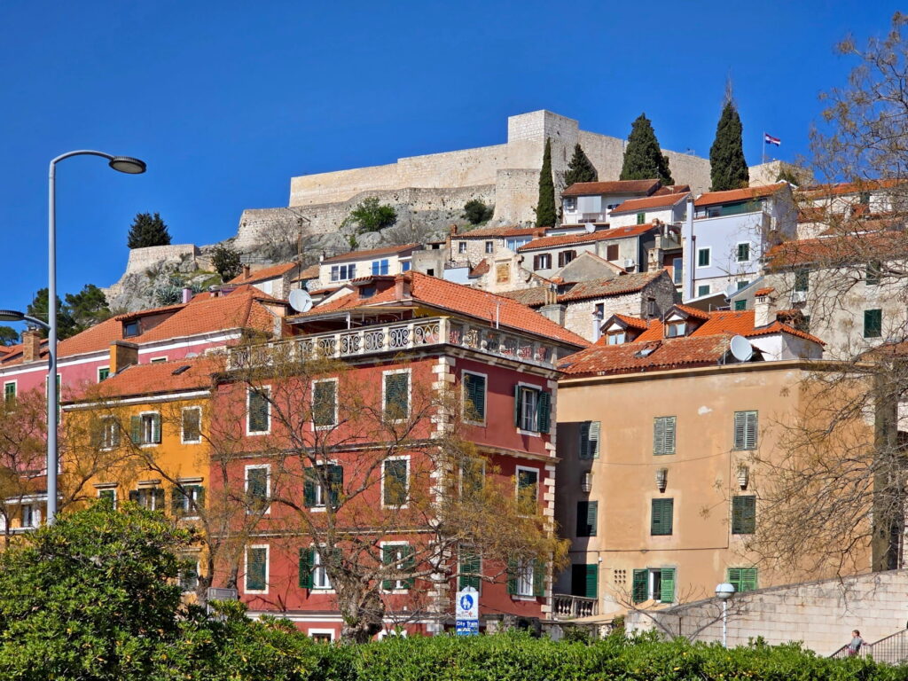 Colorful houses below St. Michael’s Fortress in Šibenik, Croatia