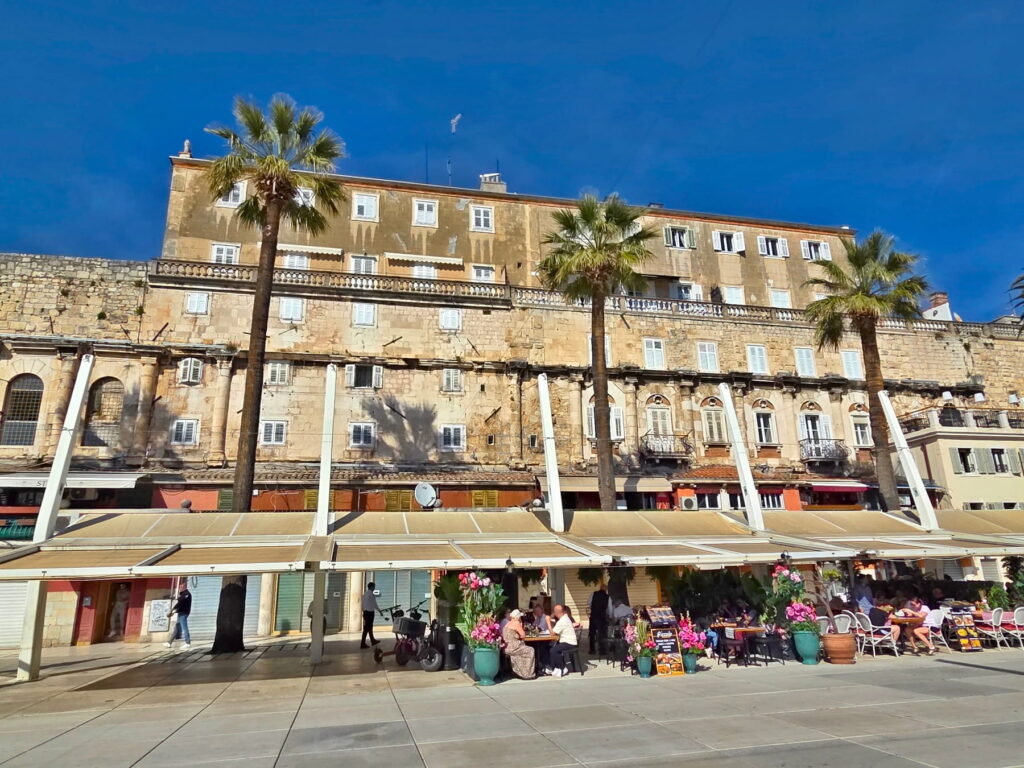 Historic waterfront buildings and cafés on the Riva promenade in Split.