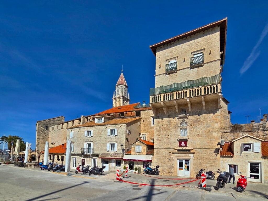 Venetian-style tower and old town buildings in Trogir, Croatia