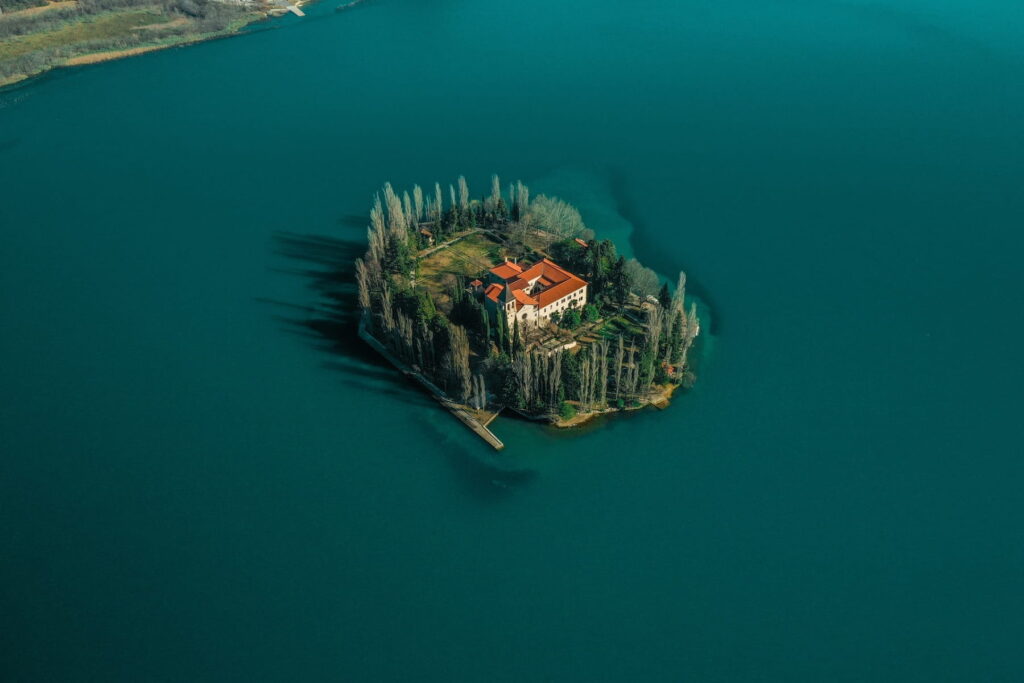 Aerial view of Visovac Monastery island surrounded by emerald water in Croatia