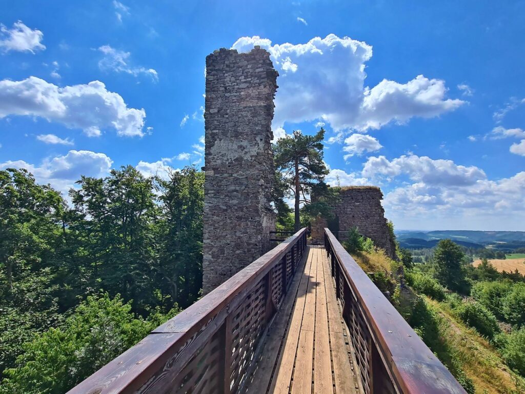 Wooden bridge crossing toward the main tower of Zubštejn Castle