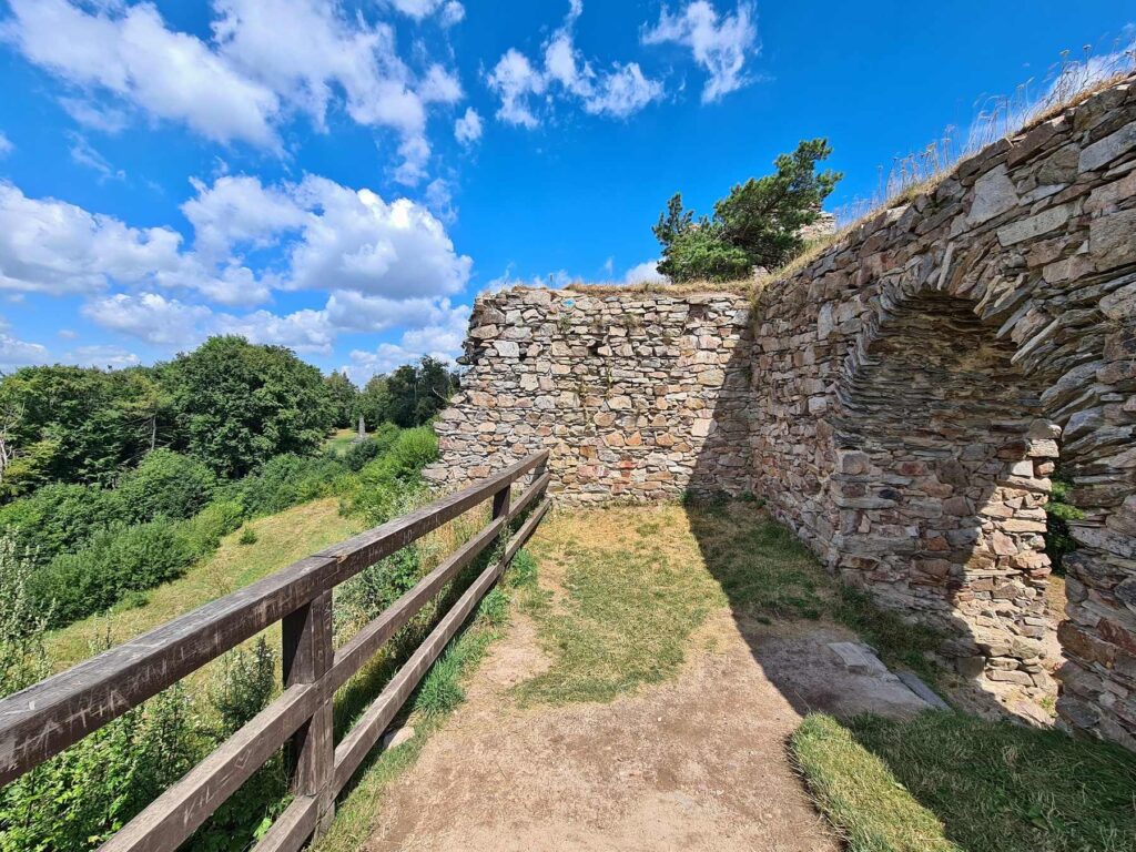Path beside castle walls at Zubštejn Castle ruins in Czechia