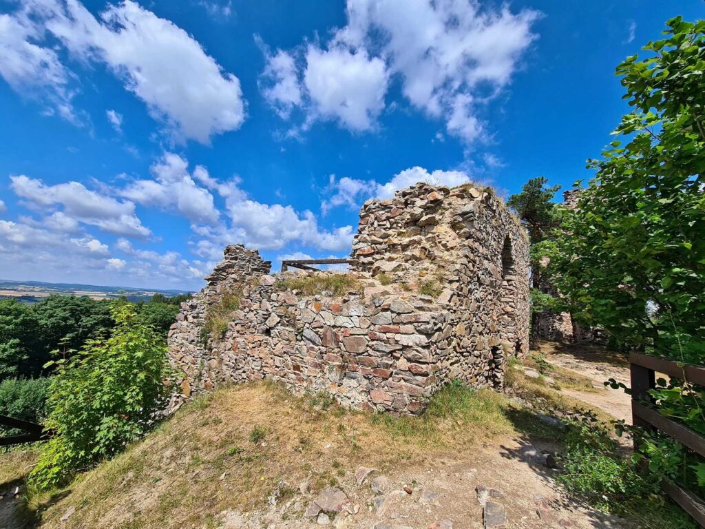 Ruined stone building at Zubštejn Castle under blue summer sky