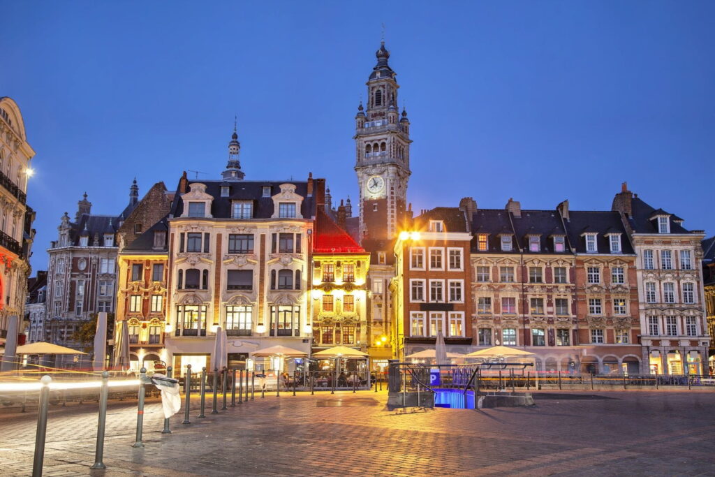 Grand Place and Belfry tower at dusk in Lille, France