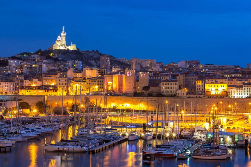 Night view of Marseille harbor and Notre-Dame de la Garde in France