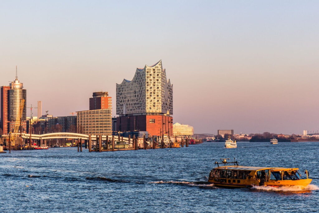 Elbphilharmonie and harbor ferry on the Elbe River in Hamburg, Germany