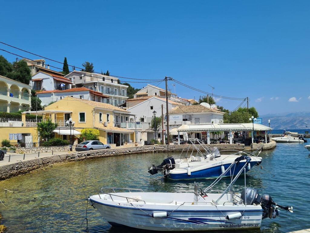 Small boats moored along the harbor in Kassiopi, Corfu, Greece