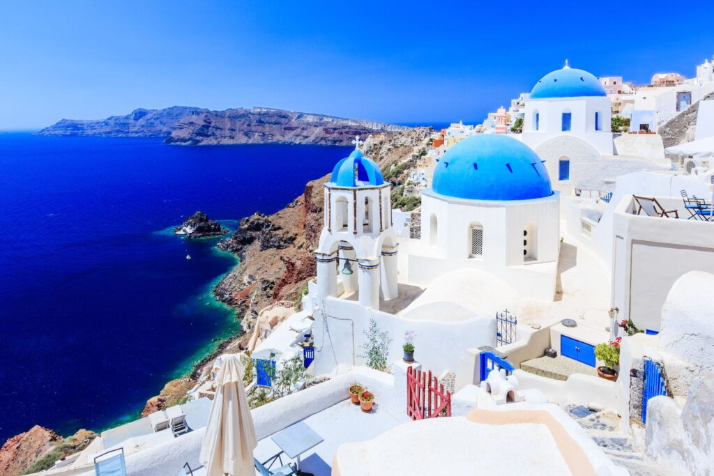 Blue-domed churches overlooking the caldera in Oia, Santorini, Greece