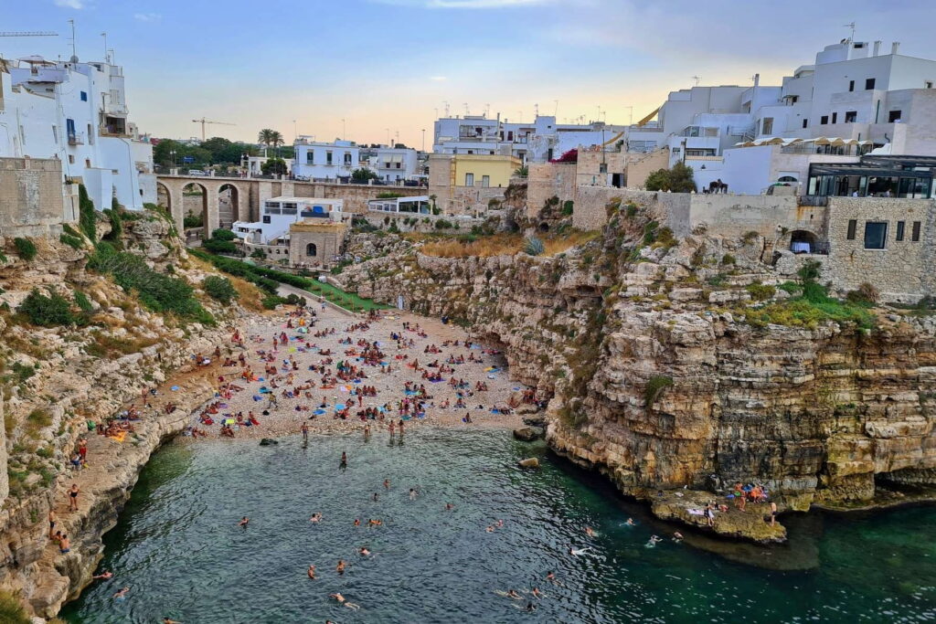 Lama Monachile beach between limestone cliffs in Polignano a Mare, Italy