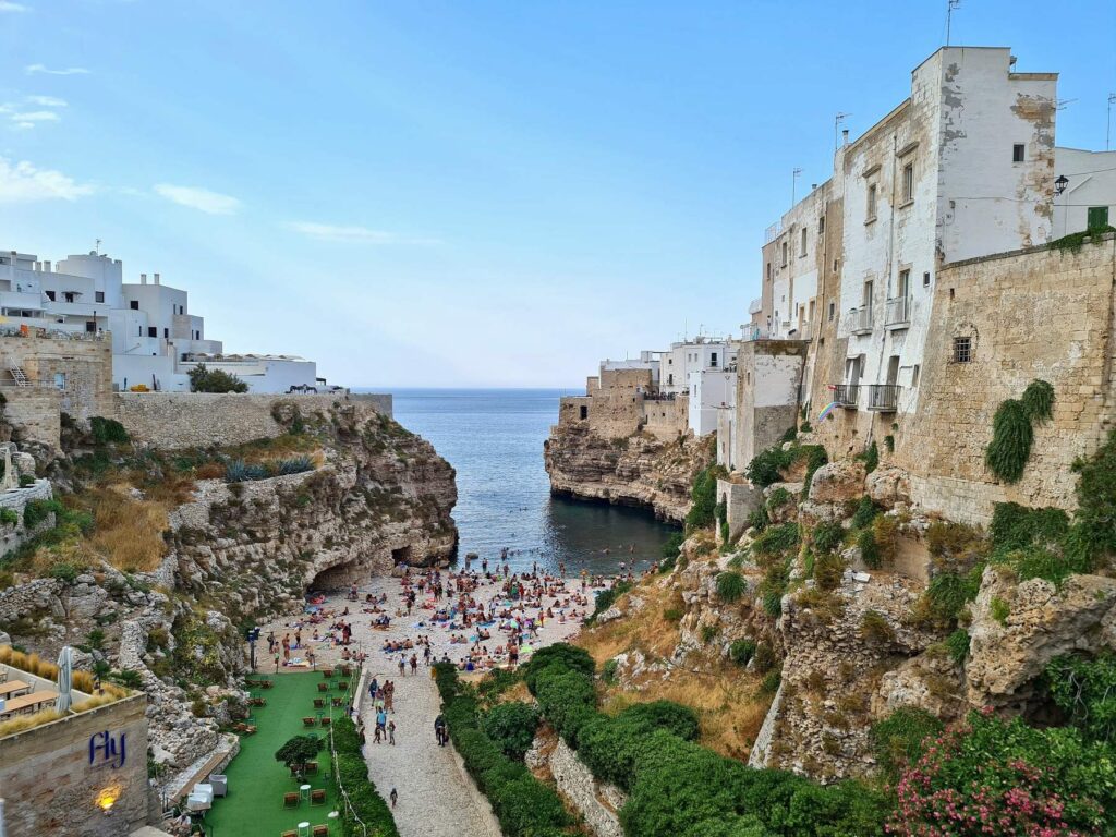 View of Lama Monachile beach and cliffs in Polignano a Mare, Italy