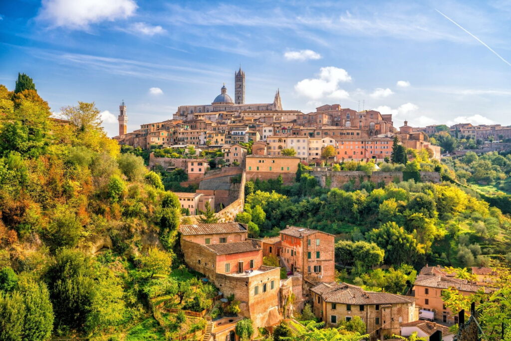 Historic skyline of Siena surrounded by Tuscan hills in Italy