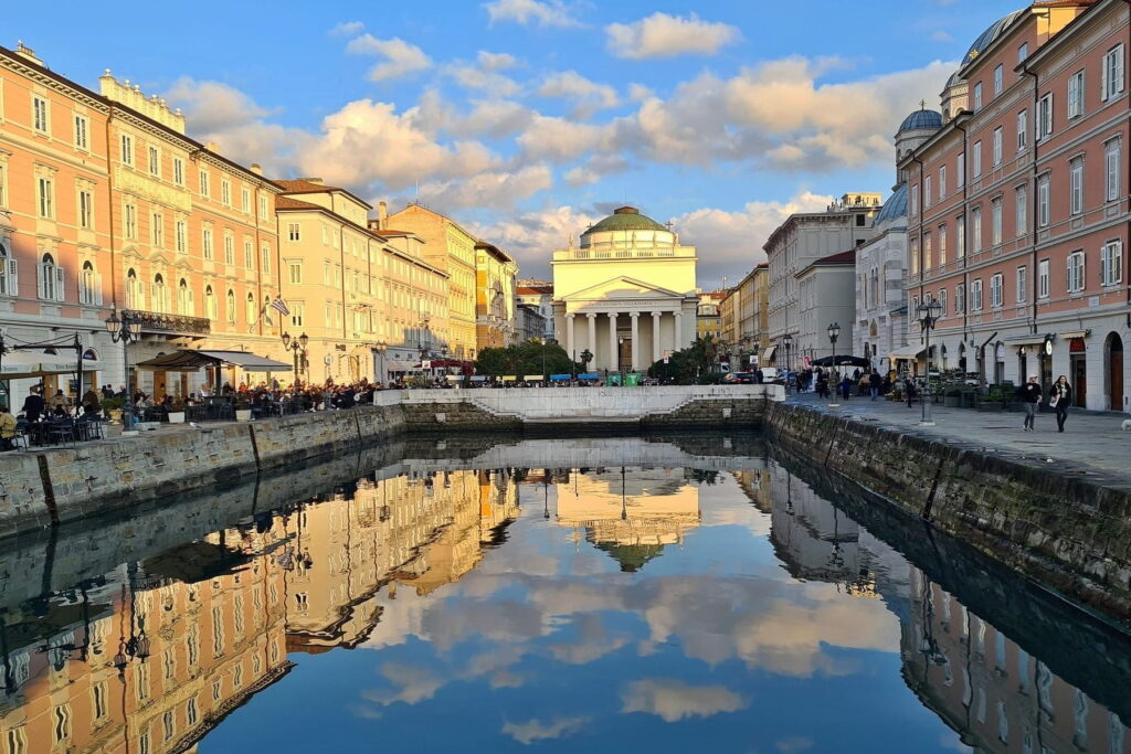 Grand Canal and Sant’Antonio Nuovo church in Trieste, Italy at sunset
