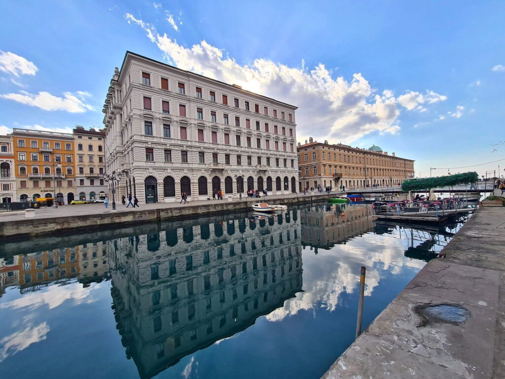Canal waterfront and historic buildings in Trieste, Italy