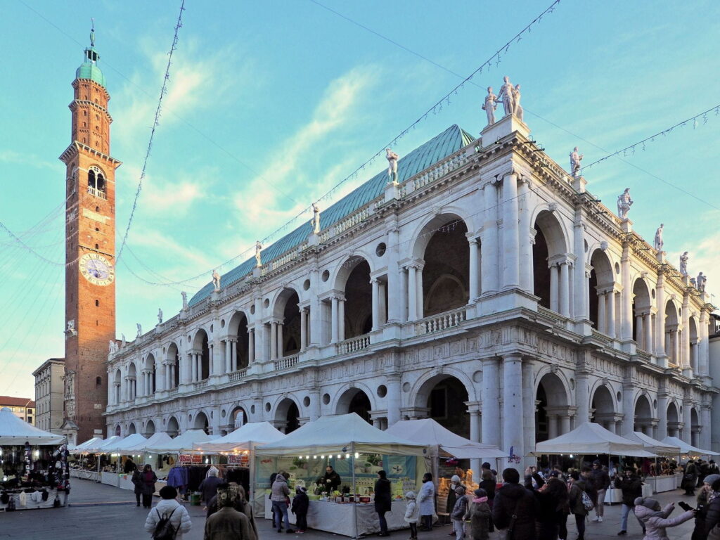 Basilica Palladiana and clock tower during a market day in Vicenza, Italy
