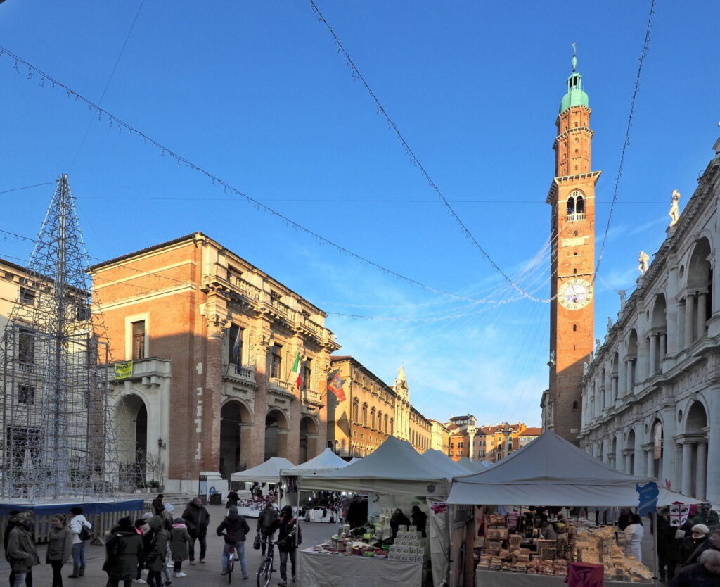 Piazza dei Signori with Torre Bissara and market stalls in Vicenza, Italy