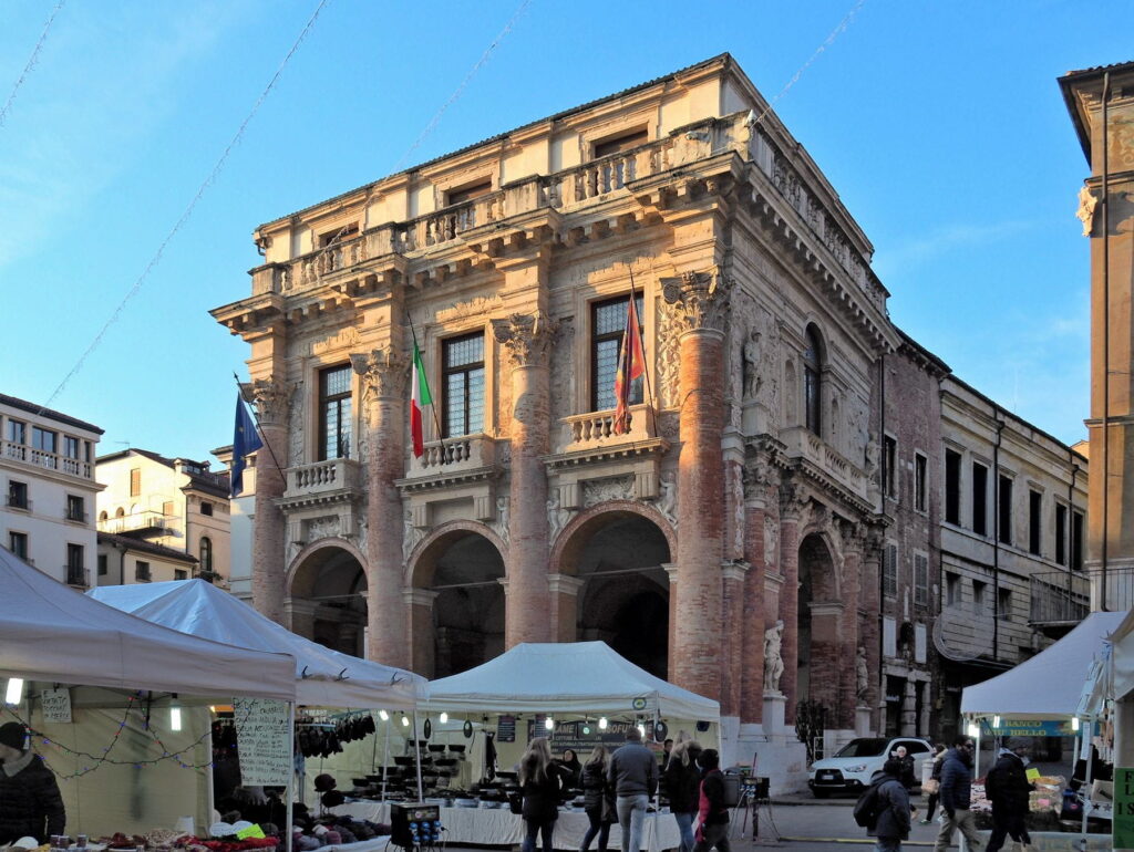 Loggia del Capitaniato facade beside market stalls in Vicenza, Italy