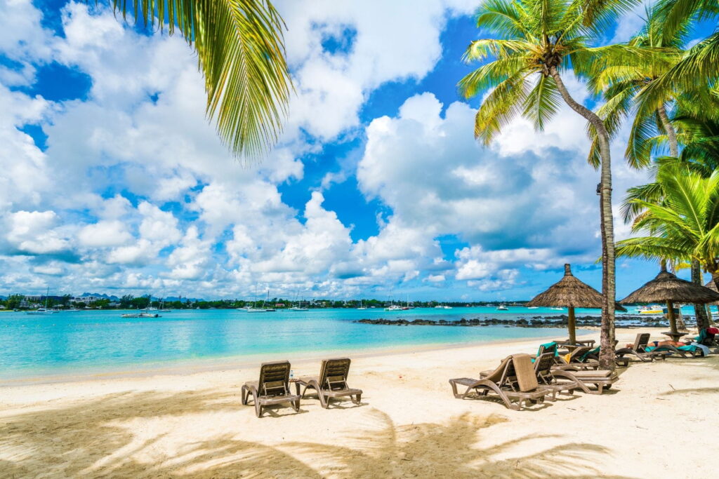 Palm-lined beach and turquoise lagoon in Grand Baie, Mauritius