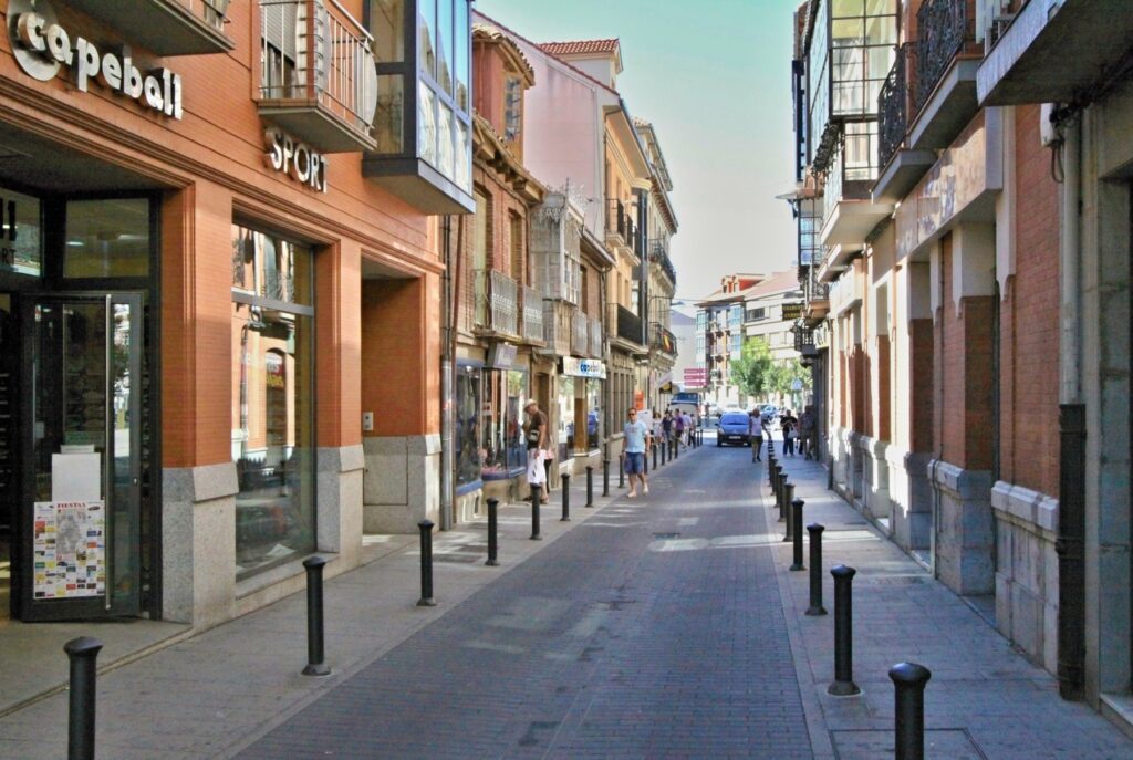 Narrow shopping street in the old town of Astorga, Spain.