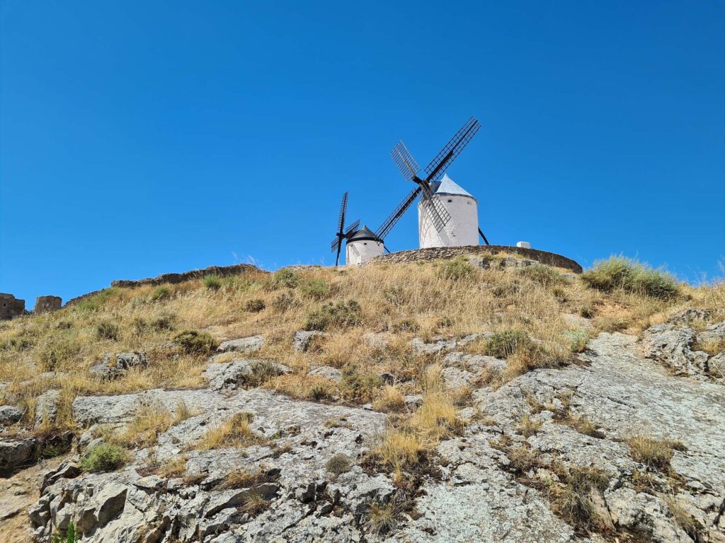 Windmills on the rocky hillside of Consuegra, Spain in the Castilla-La Mancha region.
