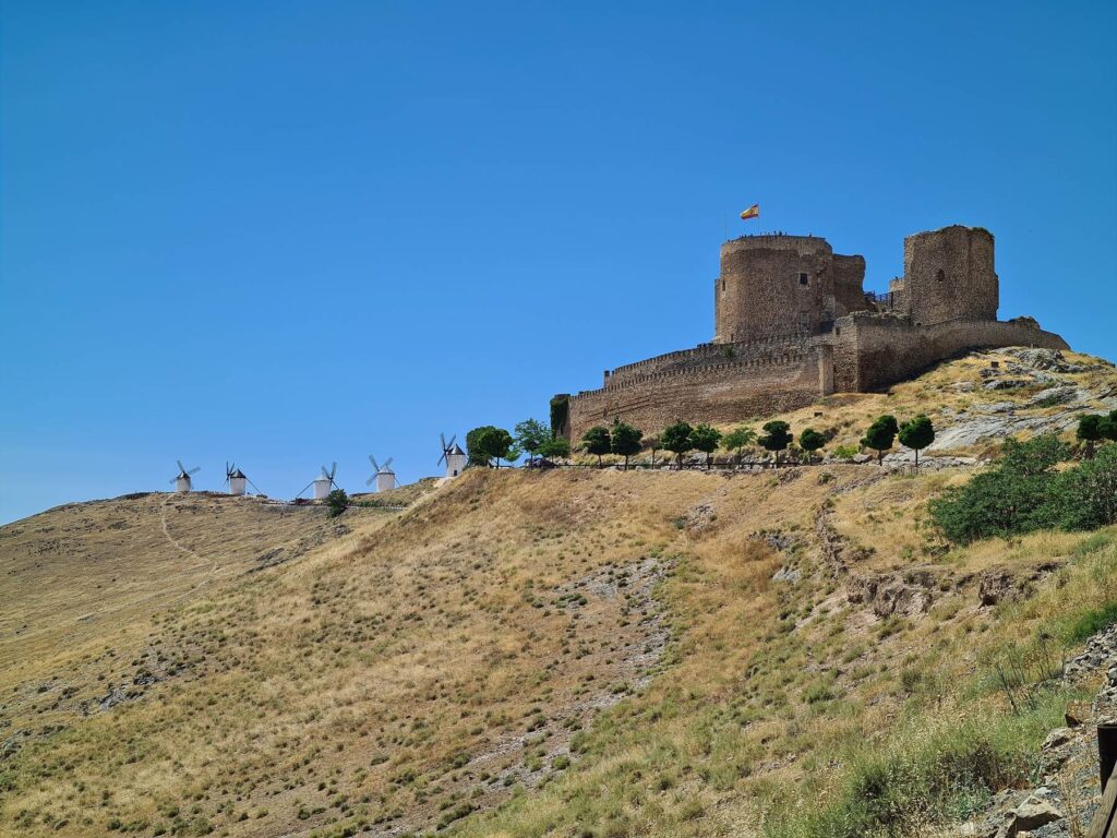 Consuegra Castle and windmills on the hilltop in Castilla-La Mancha, Spain.