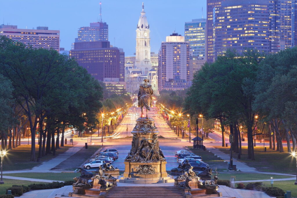 Benjamin Franklin Parkway and Philadelphia City Hall at dusk in Philadelphia, USA