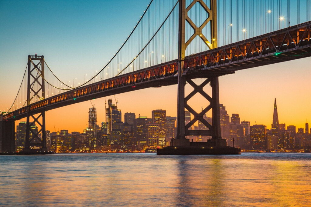 San Francisco–Oakland Bay Bridge and skyline at sunset in California, USA